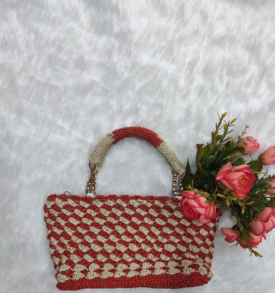 Tomato red and cream colored clutch with detachable handmade round crochet handles