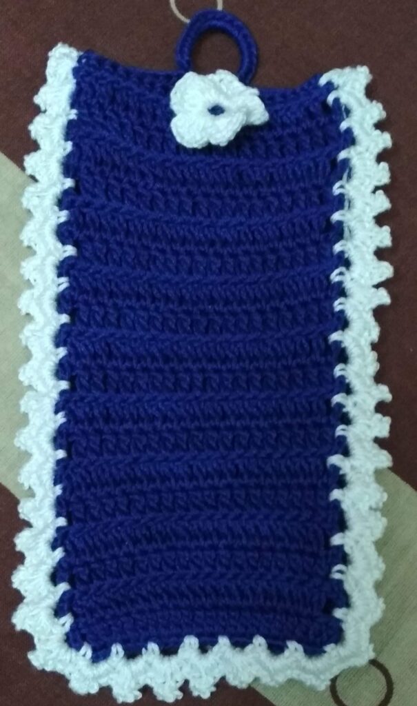 Mobile cover made of blue cotton yarn with a round loop to make it hanging.